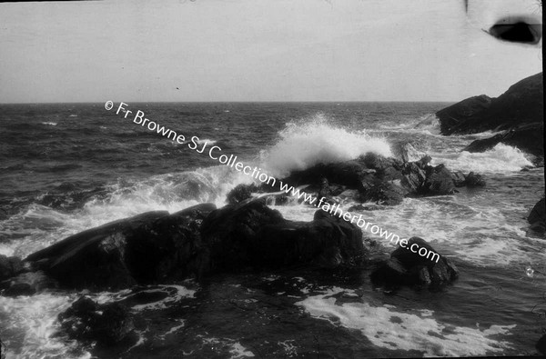 WAVES BREAKING ON ROCKS